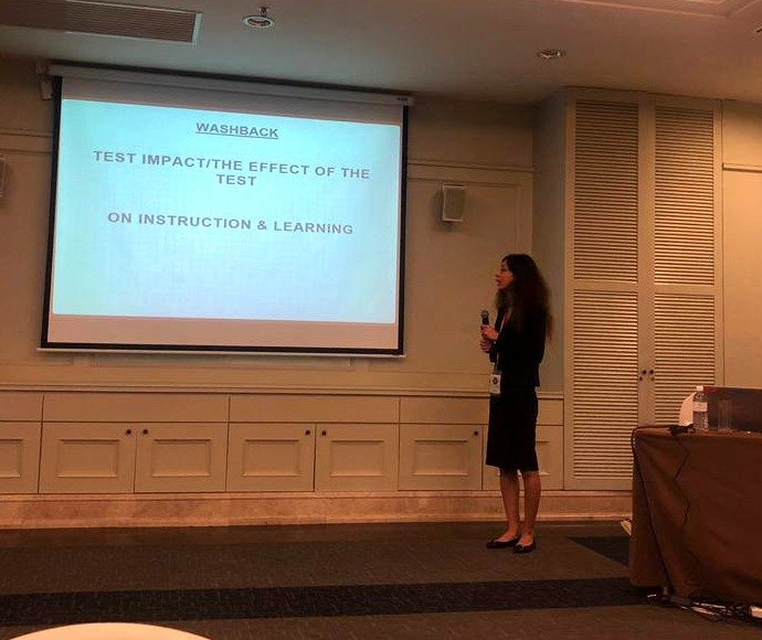 Melica Mahmoudi presenting on the impact of testing on instruction and learning